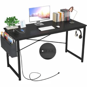 Black computer desk with power outlets and storage bag for home office