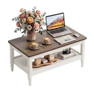 Off white and brown farmhouse coffee table with laptop and flowers on top