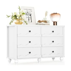 Modern white 6-drawer double dresser with a decorative scalloped wave design on drawer fronts, featuring round black metal knobs and turned solid wood feet, displayed on a clean white background.