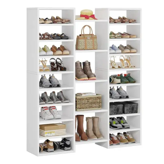 14-tier freestanding shoe cabinet in a clean all-white finish with 22 open cubbies and central shelving filled with bags, books, and boots