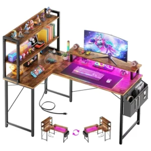 Reversible L-shaped gaming desk with bookshelf, monitor riser, LED lights, and charging station in rustic brown