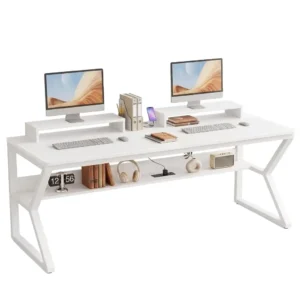 White 63-inch two-person computer desk featuring dual monitor risers and an integrated power strip