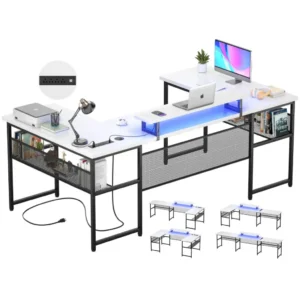White L-shaped computer desk with LED lights monitor stand and power outlets for modern home office gaming setup