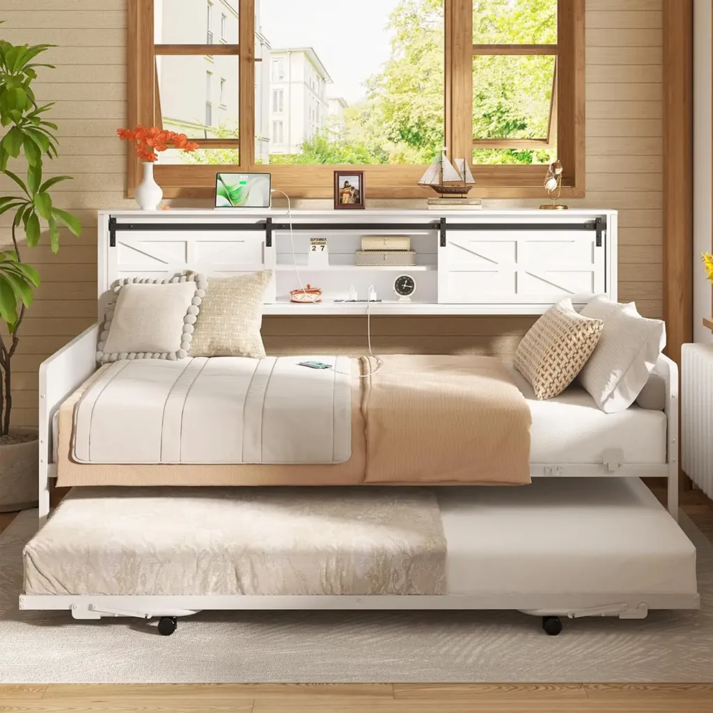 white metal daybed frame with pulled out trundle bed
