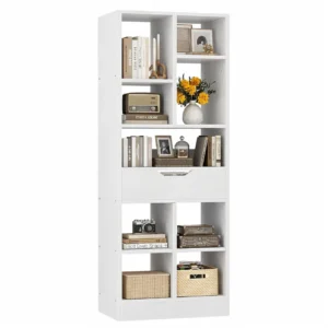 White tall narrow bookshelf featuring a 7-tier geometric open display layout, one mid-level storage drawer, and a freestanding vertical tower structure
